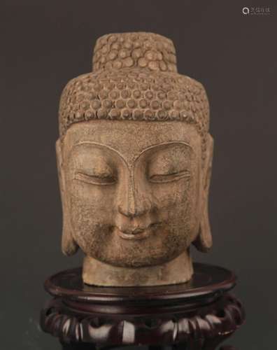 A LARGE STONE BUDDHA HEAD