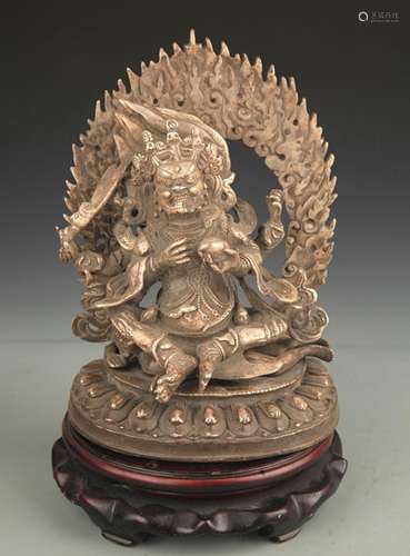 A SILVER COVER FOUR-ARMED MAHAKALA STATUE