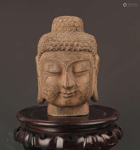 A LARGE STONE BUDDHA HEAD