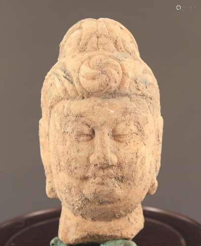 A LARGE STONE BUDDHA HEAD