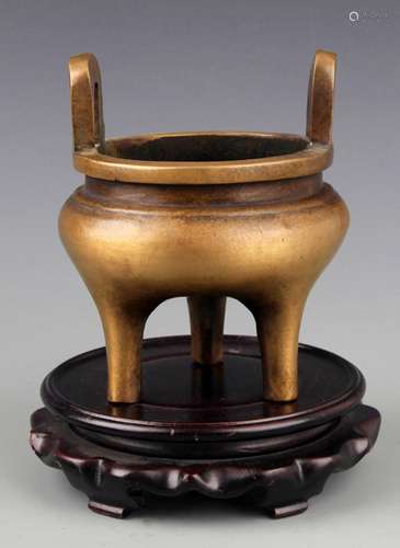 A HIGH FOOT ROUND BRONZE CENSER