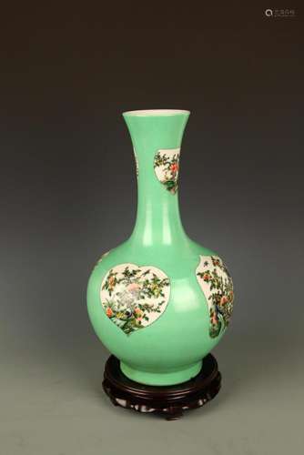 A GREEN GROUND LONG NECK FLOWER PATTERN VASE