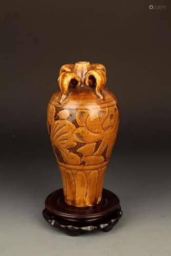 A BROWN COLOR GLAZED FLOWER CARVING PORCELAIN MEI BOTTLE