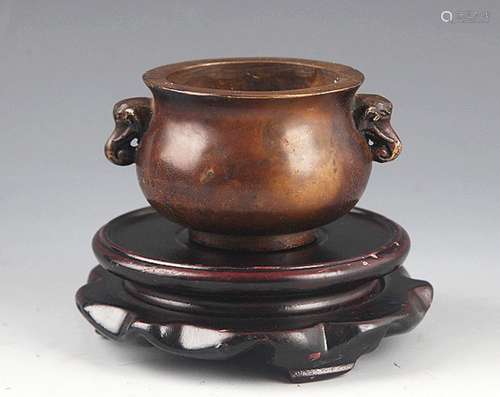 A SMALL ELEPHANT EAR BRONZE CENSER