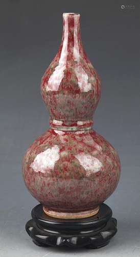 A RED COLOR CUCURBIT SHAPED PORCELAIN BOTTLE