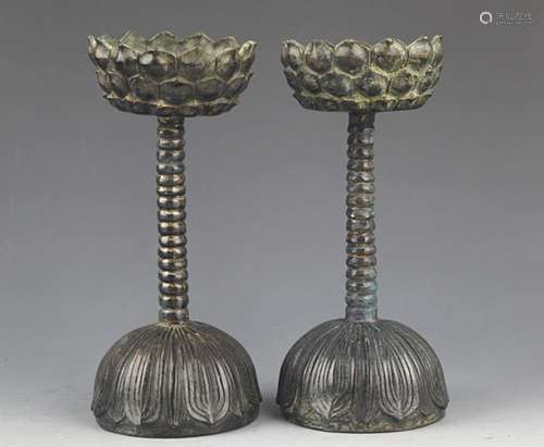 A PAIR OF LOTUS SHAPED TALL CANDLESTICKS