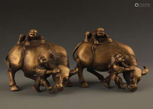 PAIR OF BRONZE BOY WITH BUFFALO DECORATION