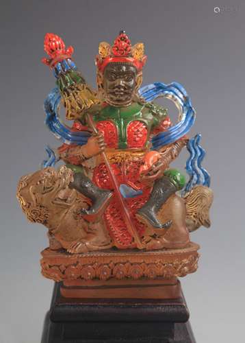 A COLOR AND GILT GLASS TREASURE KING STATUE