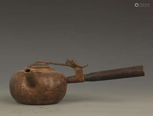 A FINE LONG HANDLE AND CARVED WATER EWER