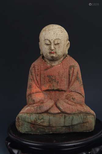 A WOODEN AND COLOR PAINTED BUDDHA