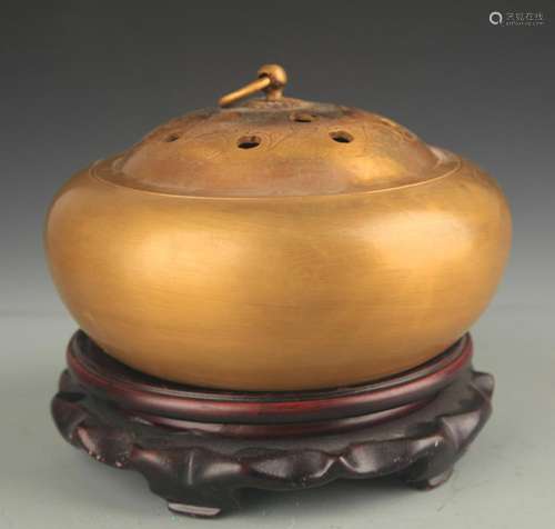 A BRONZE ROUND AROMATHERAPY BURNER