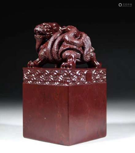 A RED SOAPSTONE BEAST SHAPED SEAL