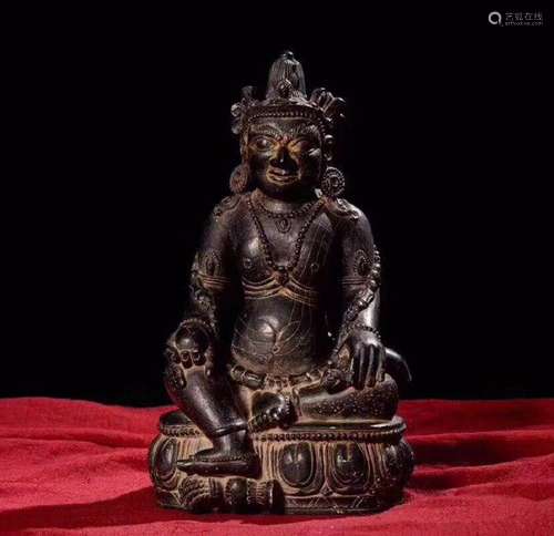 A STONE CARVED MONEY-BUDDHA STATUE