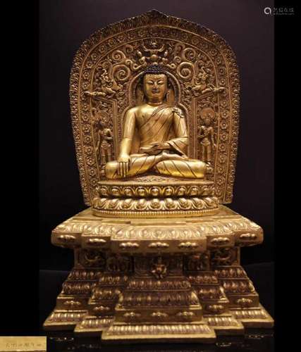 A GILT BRONZE MOLDED SHAKYAMUNI STATUE