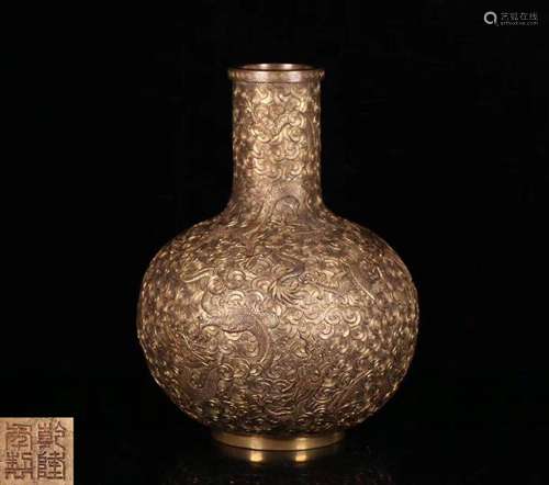 A GILT BRONZE MOLDED DRAGON PATTERN VASE