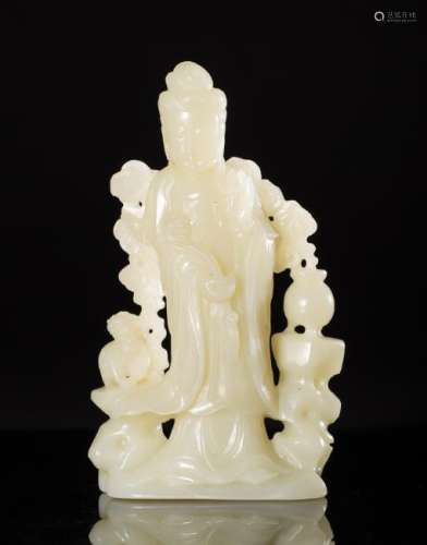 A HETIAN JADE CARVED GUANYIN FIGURE