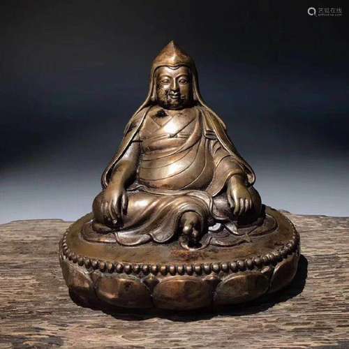 A BRONZE MOLDED BUDDHA STATUE