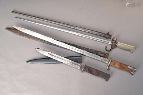 three Knives/Bayonets, beginning 20th c., one with saw