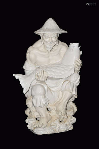 A Partially Glazed White Porcelain Fisherman Statue