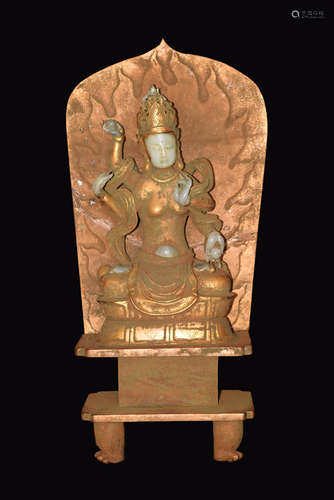 A Gold Leaf Covered Jade Four-Arm Guanyin Mounted on Gilt Bronze Seat