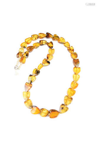 A Myanmarese Blue Amber Heart Shaped Bead Necklace