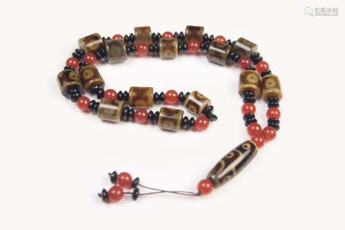 A Tibetan Nine-Eye Dzi Bead Necklace