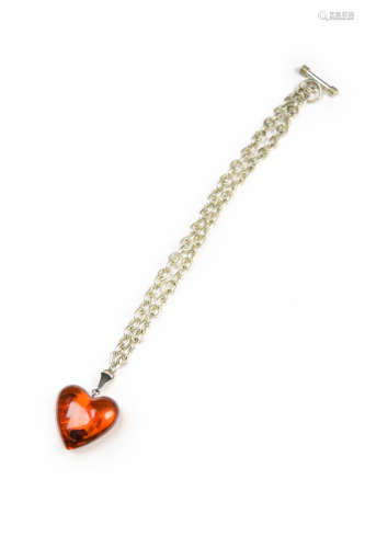 A Myanmarese Amber Heart Shaped Pendant Necklace with Silver Chain