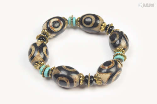 A Tibetan Three-Eye Dzi Bead Bracelet