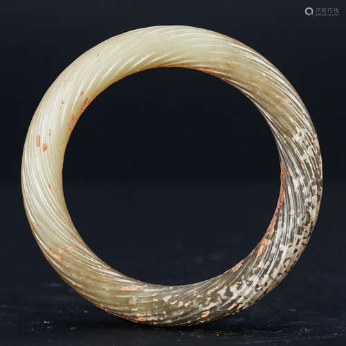 CHINESE ARCHAIC JADE TWISTED BANGLE