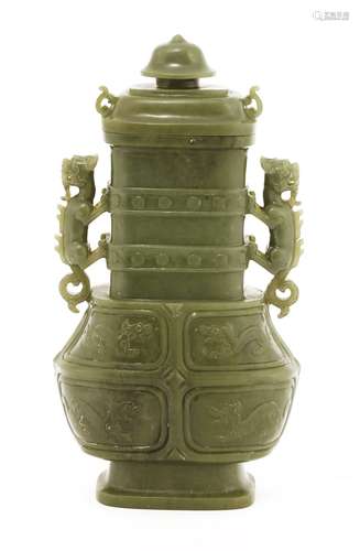 A Chinese hardstone vase and cover, Republic period (1912-1949), carved in archaic bronze shape, ...