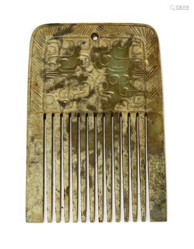 A Chinese jade comb, engraved with archaic scrolls surrounded by a border with symmetrical lines, ...