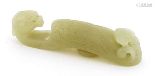 A Chinese jade belt hook, Qing dynasty (1644-1911), of typical form, one end with a phoenix head, ...