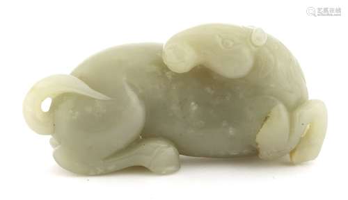 A Chinese jade carving, of a recumbent horse turning its head to the back, details of fur in ...