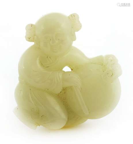 A Chinese jade figure, late Qing dynasty, of a boy playing a drum, a ruyi sceptre in his left hand, ...