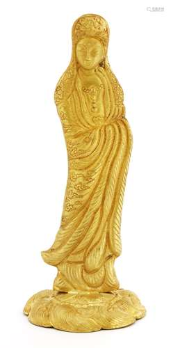 A Chinese gold Guanyin, standing on a lotus flower above waves, wearing a long robe engraved with ...