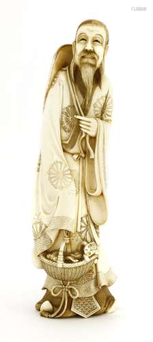 A Japanese ivory figure, c.1920, of a literatus standing in long robe, carrying a woven hat and a ...