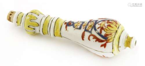 A rare Chinese export porcelain knife handle, 18th century, painted with yellow and blue enamel and ...