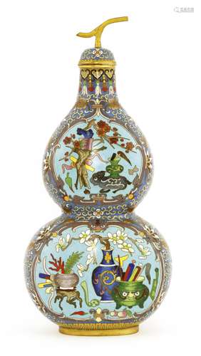 A Chinese cloisonné double gourd vase, with precious objects in shaped panels against a blue ground ...