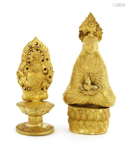 Two Chinese gold Guanyin, one double sided, seated cross-legged on a stemmed lotus pedestal, in ...