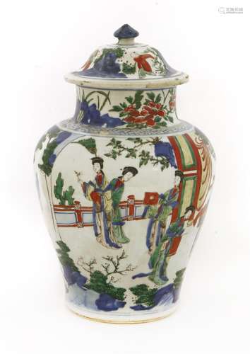 A Chinese Transitional wucai jar and cover,  17th century, of baluster form painted with figures in ...