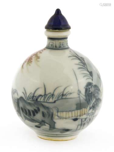 A Chinese blue and white snuff bottle, painted with a farmer ploughing a field with his buffalo, ...