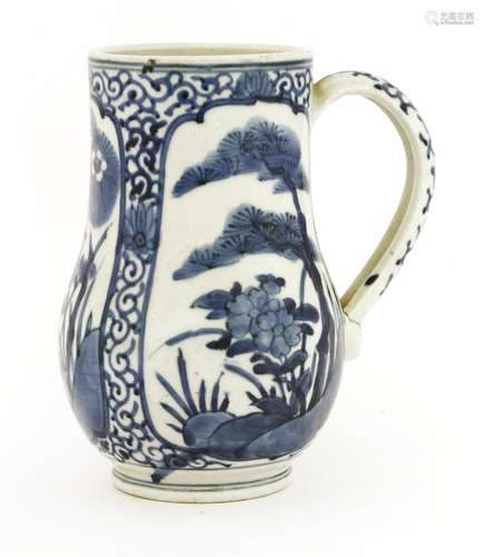 A Japanese blue and white tankard, late 17th century, painted with birds and flowers in shaped ...