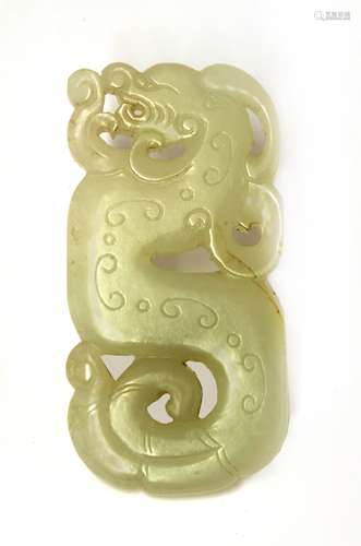 A Chinese jade plaque, Qing dynasty (1644-1911), in the shape of a dragon with engraved archaic ...