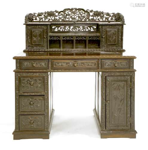 A Chinese twin pedestal desk, early 20th century, the gallery pierced and carved with Buddhist ...