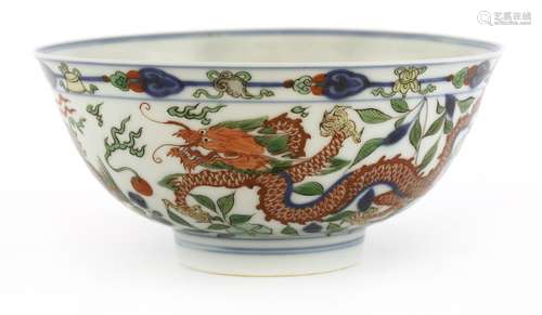 A fine Chinese wucai bowl, Kangxi (1662-1722), with deep rounded sides and a flared rim on a short ...