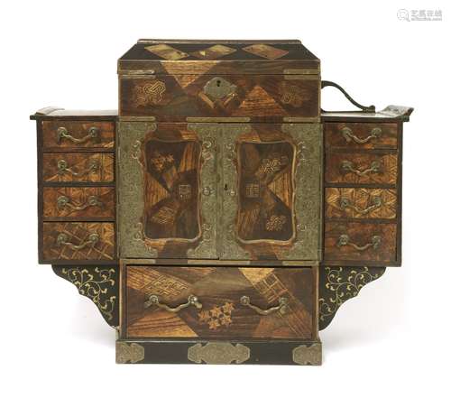 A Japanese table cabinet, Meiji period (1868-1912), with parquetry decoration, with nine short ...