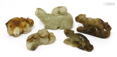 A collection of Chinese jades, 20th century, of mythical beasts, comprising a Buddhist lion and its ...