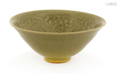 A Chinese Yaozhou ware celadon bowl, Jin dynasty (1115-1234), of circular form with splayed mouth, ...