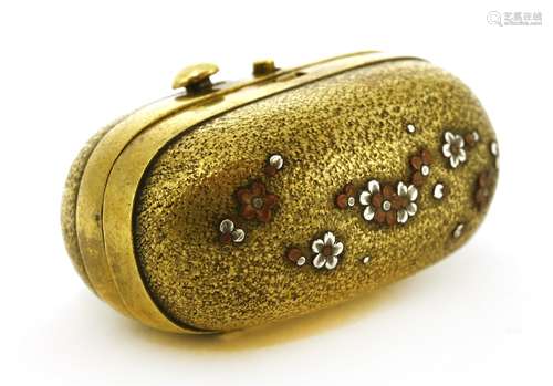 A rare Japanese brass tinder box, Meiji period (1868-1912), of oval form with copper and silver ...