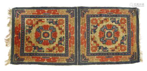 A Chinese Ningxia double mat, decorated with florets in red and blue within a key fret border ...